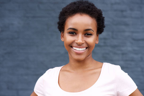 istock attractive young black woman smiling 664734658