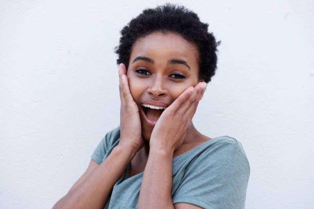 istock young black woman with surprised expression on face 664734792