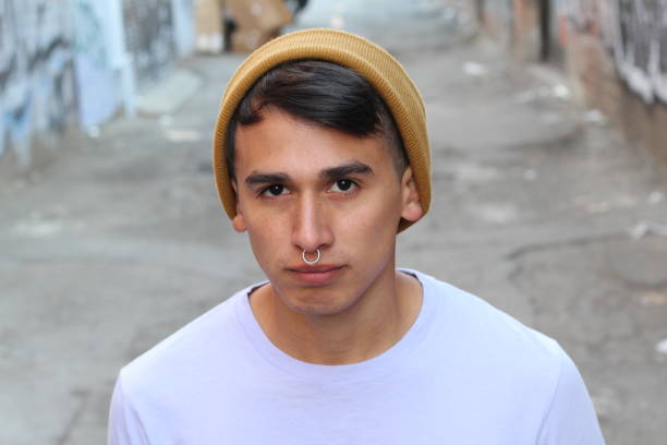 Hip young Hispanic man outdoors.