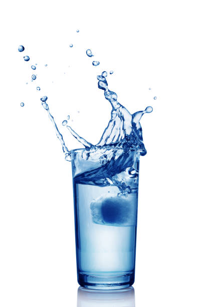 istock Splash in glass of blue water with ice cube 664738230