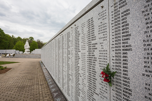 Lestene, Latvia - May 18, 2014: Cemetery of Latvian Legionnaires killed during World War II in Lestene– with the monument “Motherland - Latvia\