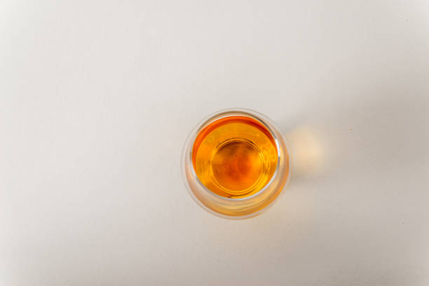 istock Top view of a single malt whiskey glass, on a white background 664764452