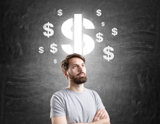 istock Man in T-shirt and dollar signs 664764822