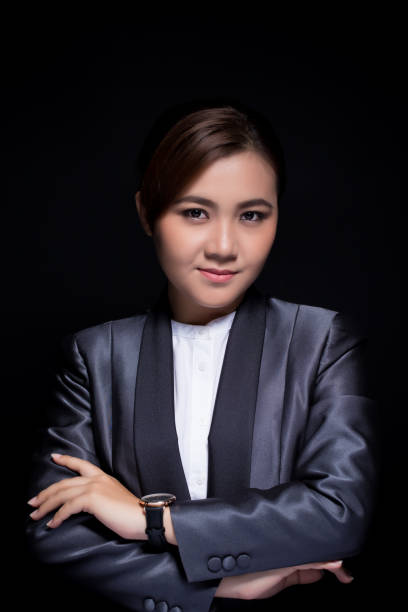 istock Scheming businesswoman planing something isolated on black background 664768520