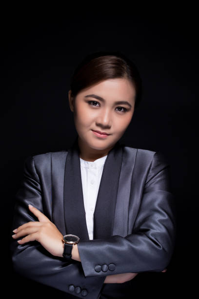 istock Scheming businesswoman planing something isolated on black background 664768600