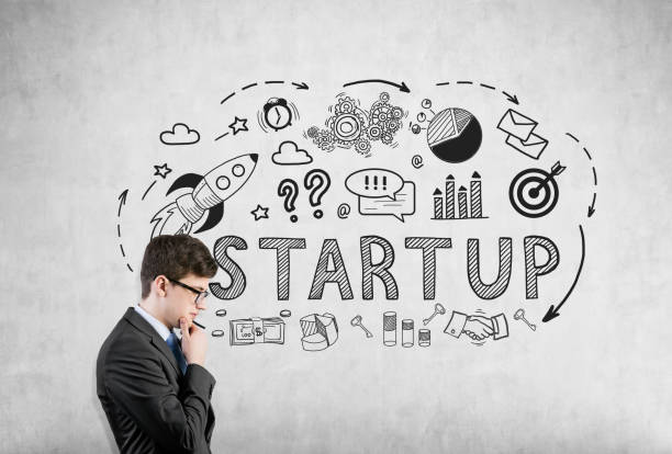 istock Businessman in glasses and startup on concrete 664768784