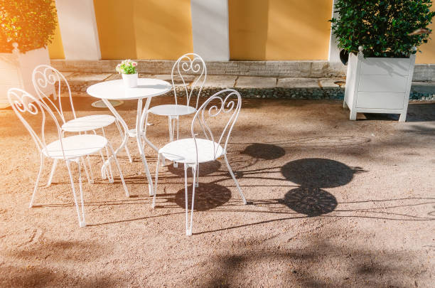 istock Table and chairs in the summer cafe in the park 664771236