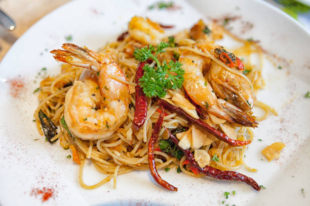 istock Garlic and oil spaghetti with spicy shrimpgg 664772100
