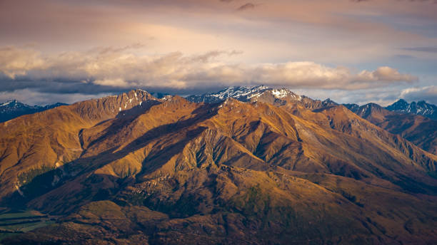 istock Landscape view of mountain range at sunrise, Wanaka Lake, NZ 664775556