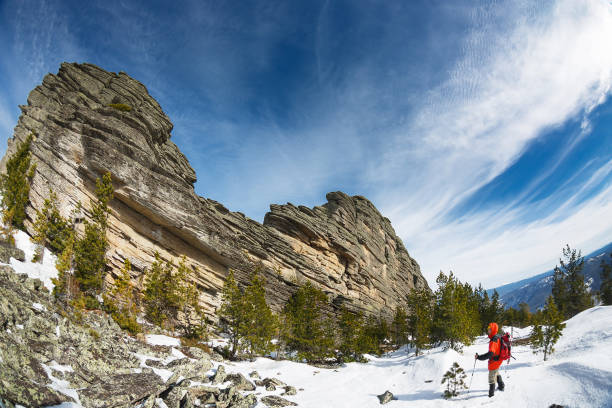 istock Winter Hiking in the mountains with a backpack and snowshoes 664776266
