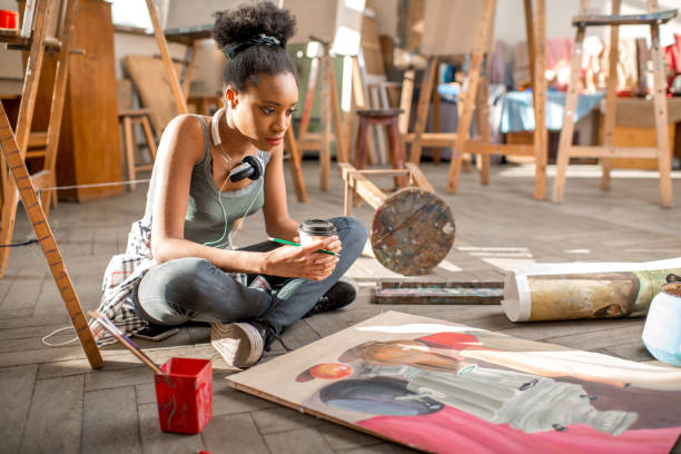 istock Creative student painting at the university 664782560