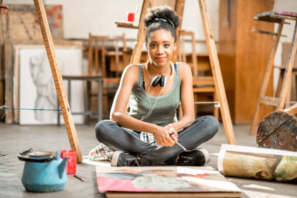 istock Creative student painting at the university 664785650