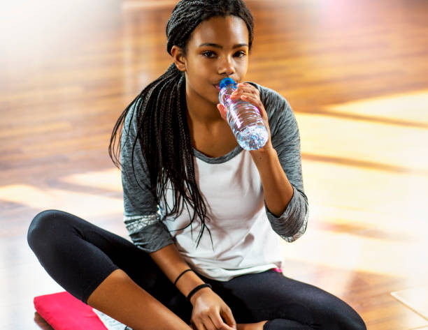 istock Cute sport girl drinking water. 664786494