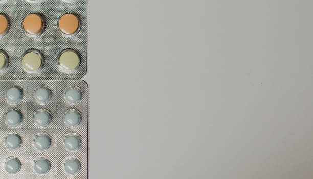 Medicines on a gray background of a different color