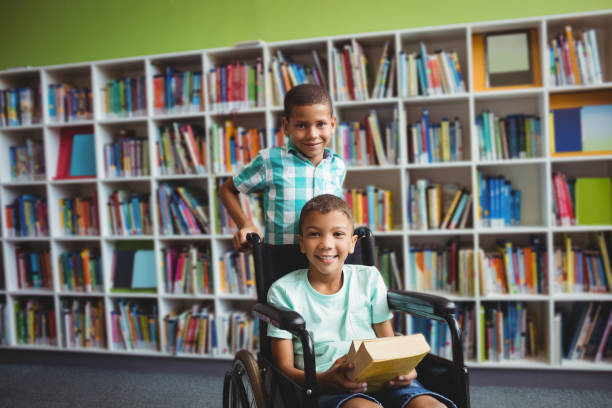 istock Little boys holding books 664792994