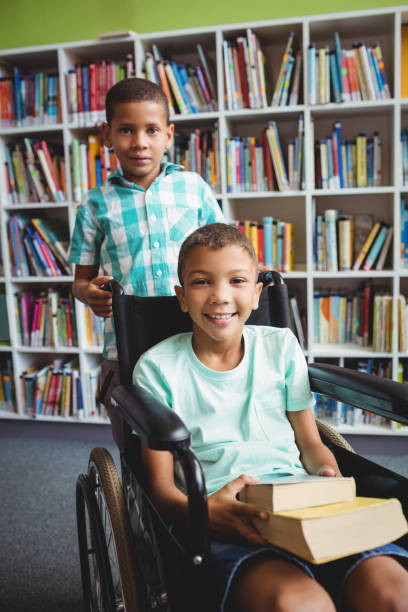 istock Little boys holding books 664793232