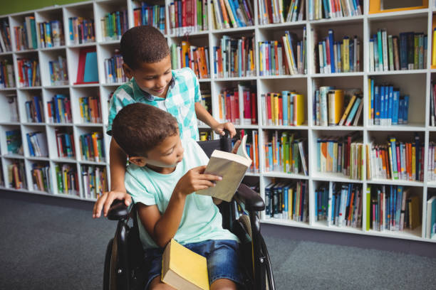 istock Little boys holding books 664795720