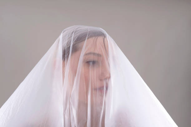 istock woman behind foil 664796194