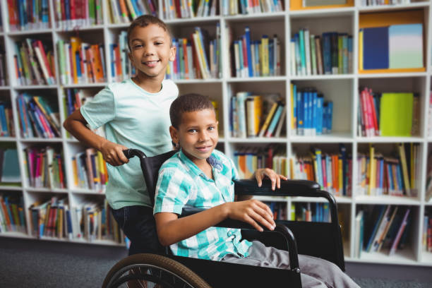 istock Boy pushing the wheelchair 664796524
