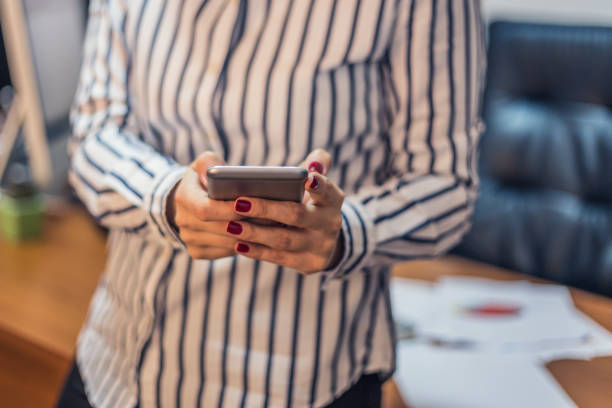 istock Businesswoman using mobile smart phone. 664803880