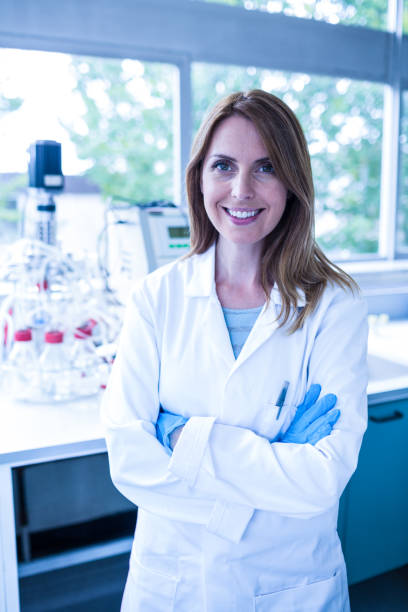 istock Scientist smiling at the camera in lab 664804362