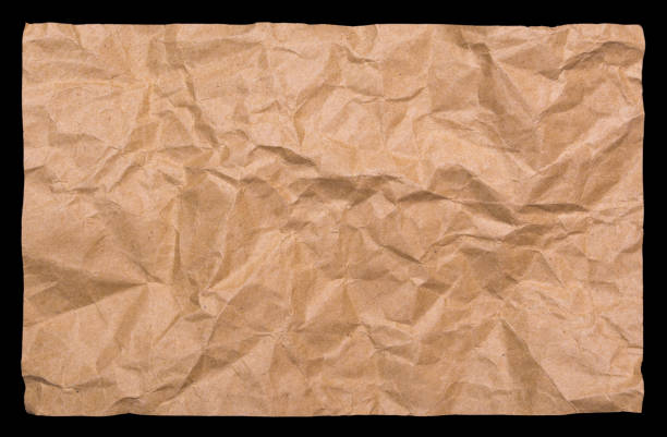 Crumpled kraft paper isolated on a black background