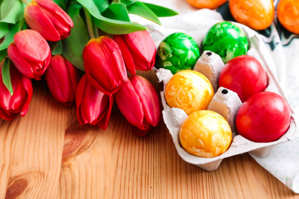 istock Six colorful egg candles with tulips 664811250