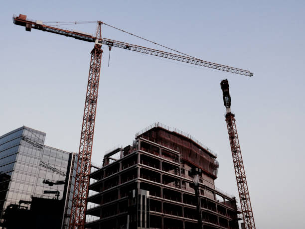 Architecture and modern office buildings in capital city of EU Brussels, Belgium. Construction machinery, crane and concrete blocks near the construction site in Brussels.