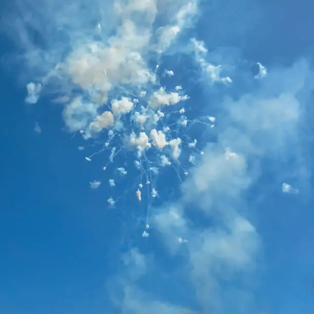 Photo of Fireworks and smoke in the blue sky in day time Ischia Italy