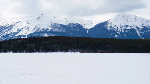 istock Frozen lake and mountain with snow covered 664820362
