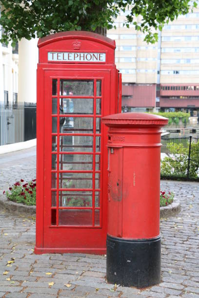 istock Red mailbox and telephone cell in London, Great Britain 664826446