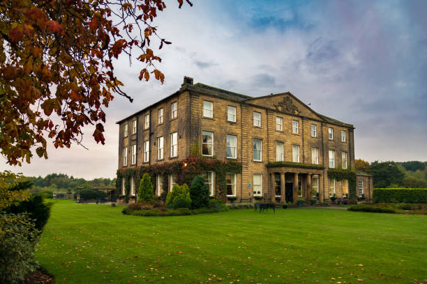 Walton Hall in a scenic setting of rolling parkland with its own lake. Wakefield, United Kingdom - October 20, 2016: Walton Hall, a 4 star hotel in a scenic setting of rolling parkland with its own lake, a backdrop of ancient woodland and a championship golf course. aristocrazy stock pictures, royalty-free photos & images