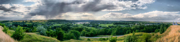 istock A rainy cloud hanging over the village, summer rain 664830434