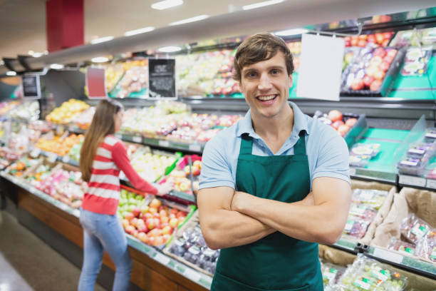 istock Shop assistant posing with arms crossed 664831896