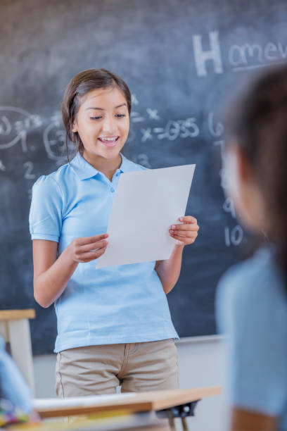 istock Junior high student gives oral report in class 664838318