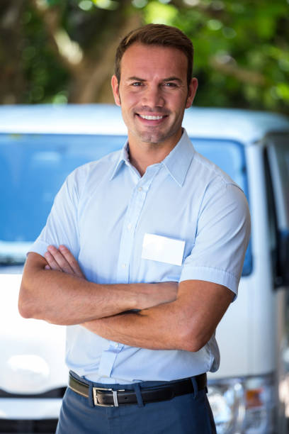 istock Handyman standing near his delivery van 664838758