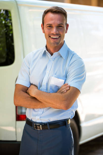 istock Handyman standing near his delivery van 664839118