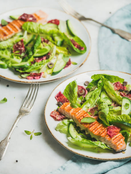 istock Healthy energy boosting spring salad with grilled salmon, orange, quinoa 664849186