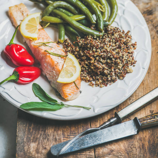 istock Roasted salmon with quinoa, chilli pepper and poached beans 664849480