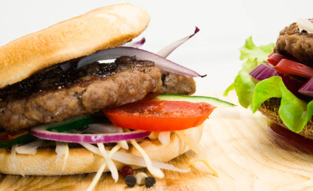 istock hamburger with vegetables and minced meat on a wooden table 664849940
