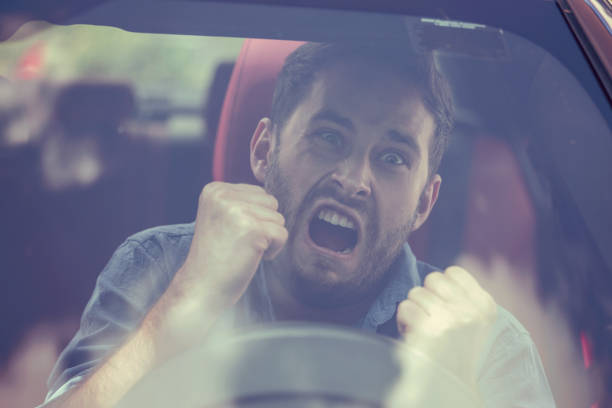 istock Windshield view of an angry driver man. Negative human emotions face expression 664857740