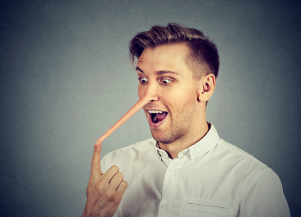 istock Man with long nose isolated on grey wall background. Liar concept. Human face expressions, emotions, feelings. 664860550