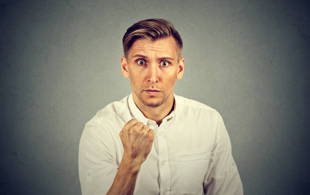 istock portrait of young angry man 664860620