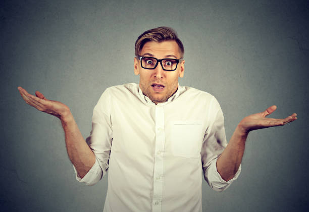 istock young man shrugging shoulders who cares 664861478