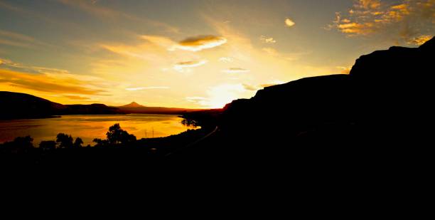 istock Silhouetted Mountains at Sunset or Sunrise 664861824