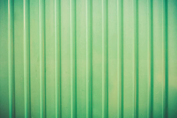 Green texture figure of corrugated. Concept: reliable, abstract, creative, art, fence.