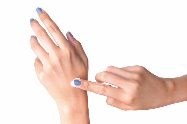 istock Woman applying hand cream, isolated on a white background 664871530
