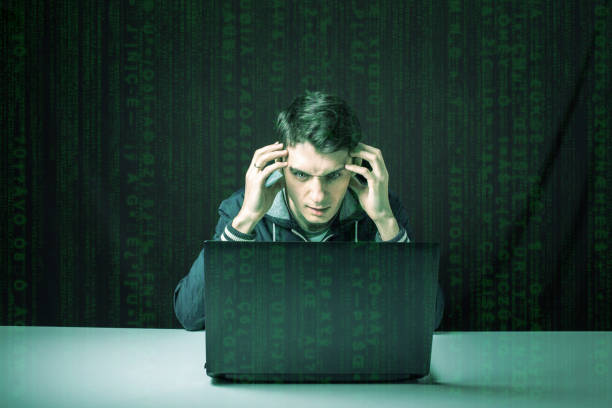 istock hacker in the dark breaks the access to steal information 664874600