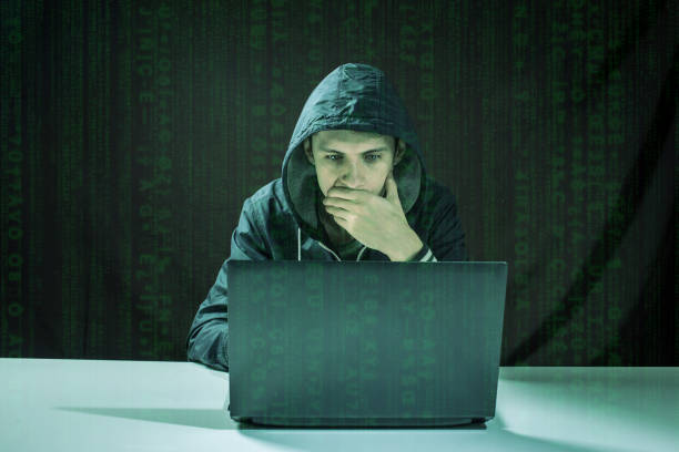istock hacker in the dark breaks the access to steal information 664874604