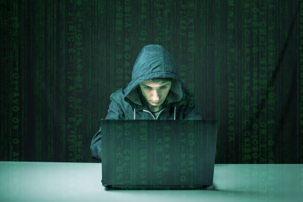 istock hacker in the dark breaks the access to steal information 664874608